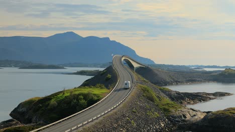 caravan car rv travels on the highway atlantic ocean road norway.