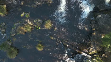 overhead view of water flowing through the anllons river in ponteceso, a coruña, spain