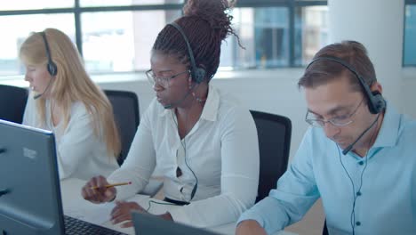 focused african american hotline call center operator