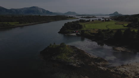 scenic view of fjord, boat houses and coastline in nordland county, norway - aerial drone shot
