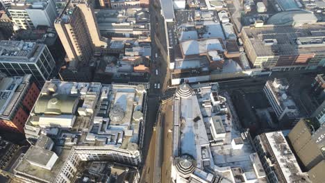 aerial drone flight over market street during lockdown showing a metrolink tram in service and the empty streets below