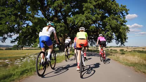 a dynamic video capturing cyclists from a low rear angle, showcasing vibrant sportswear