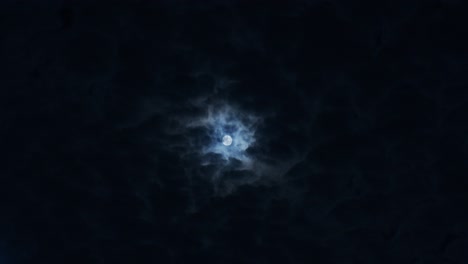 moon in the night sky with clouds