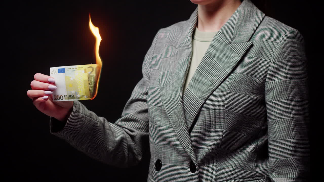 A woman burning a 200 euro bill
