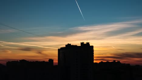 silhouette of city buildings against the backdrop of the sunset sky