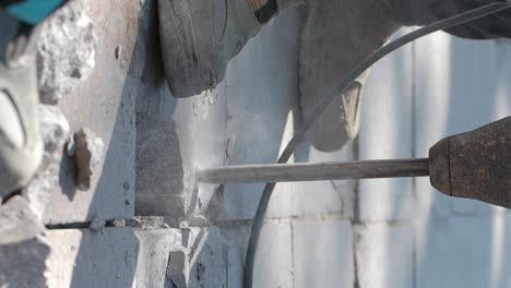 demolishing a wall with a jackhammer