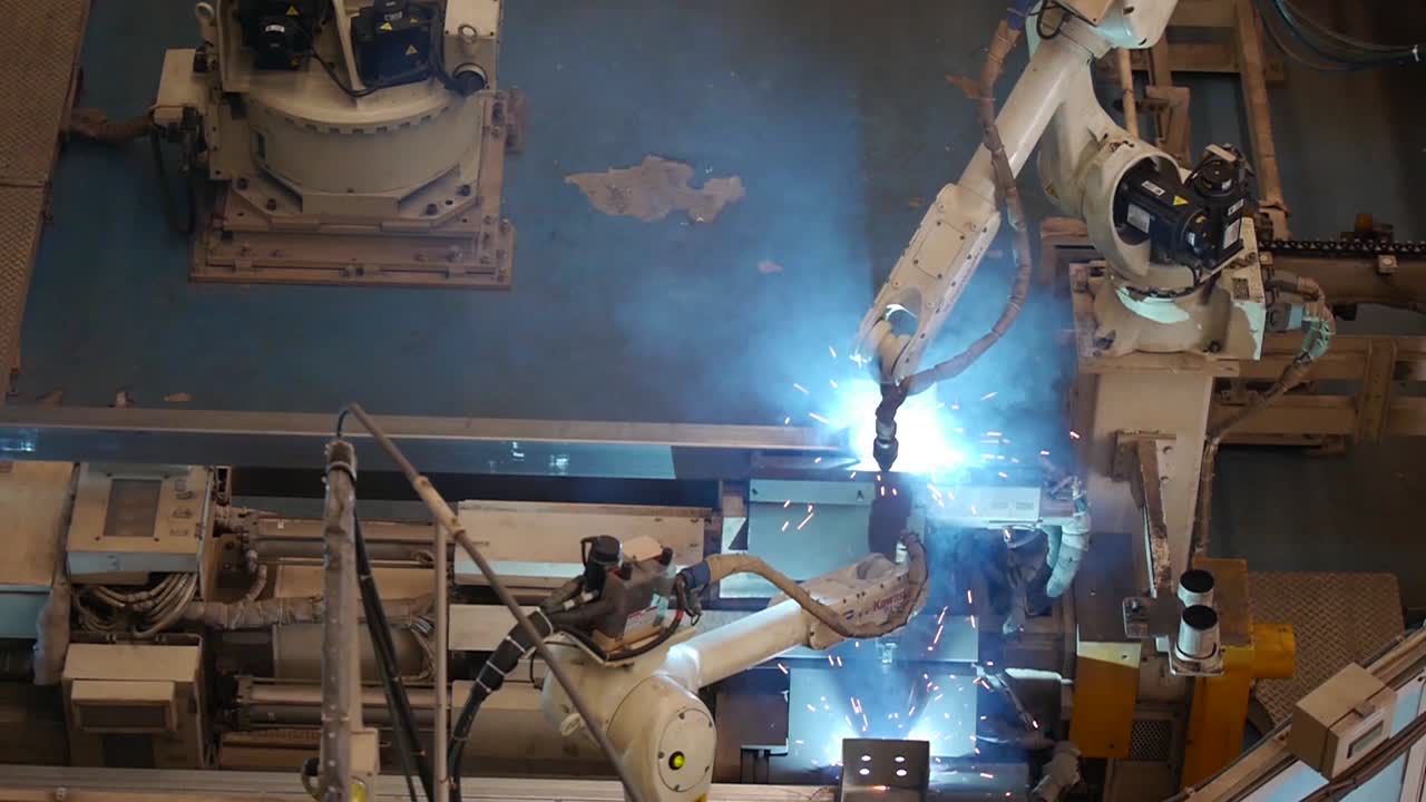 Robot Working in Heavy Metal Factory