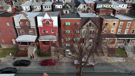 Aerial-truck-shot-of-friends-walking-on-sidewalk