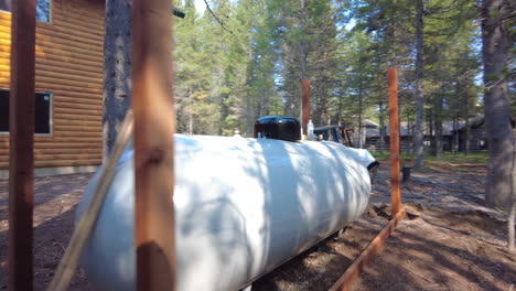 large propane storage for an outdoor cabin in the woods