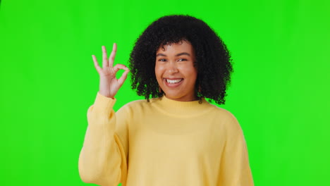 Woman,-portrait-with-hand-sign-for-ok-on-green