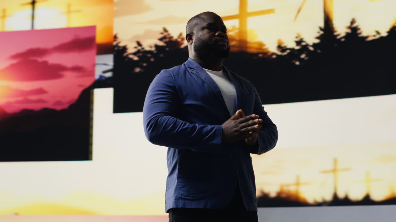Black person does meditation pose with hands together in prayer