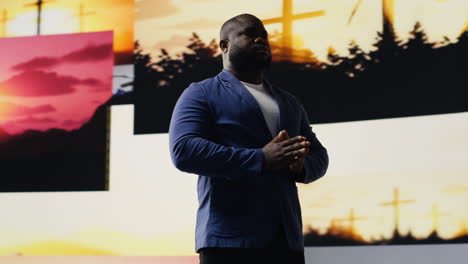 black person does meditation pose with hands together in prayer