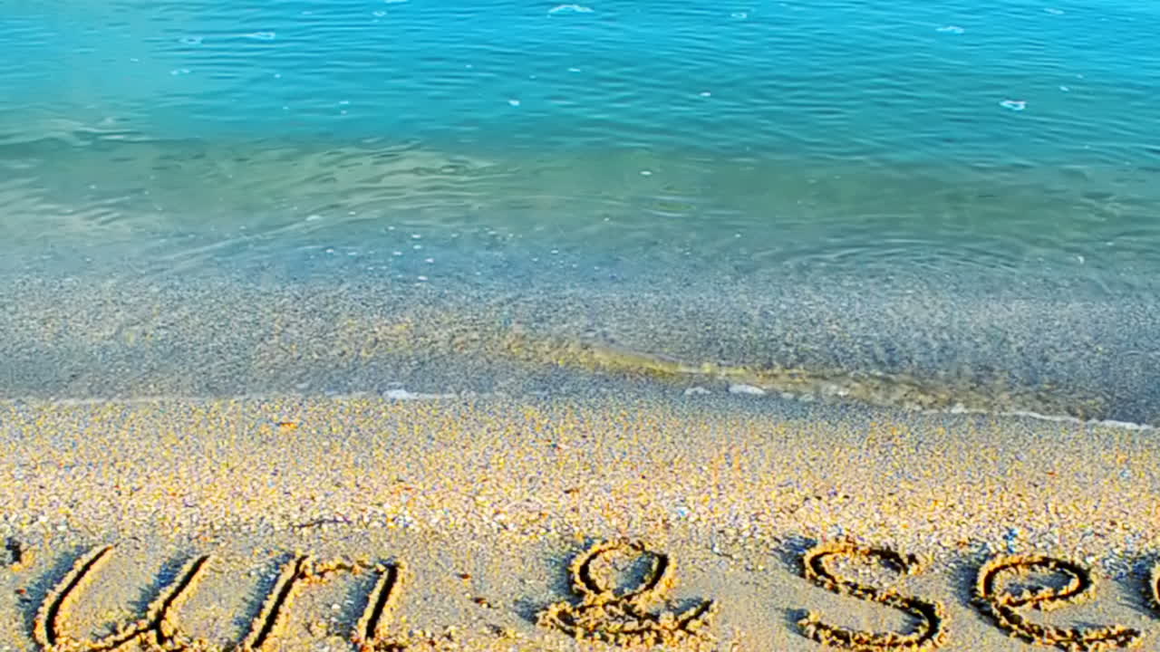 Sunny day, relax. Inscription the sun on sand, the beach