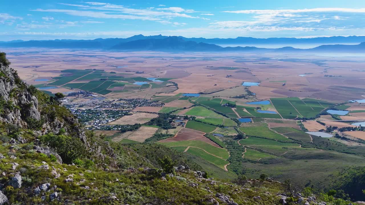 Awe-inspiring drone shots showcase the vastness of green vineyards beneath endless skies