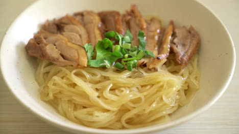 dried noodles with stewed duck in white bowl - asian food style