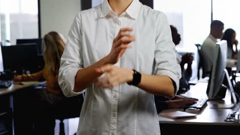 Female-executive-standing-with-arms-crossed-in-office-4k