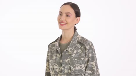smiling female soldier in camouflage uniform gesturing