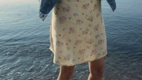 Trendy-woman-dancing-on-beach.-Cheerful-girl-having-fun-at-sea