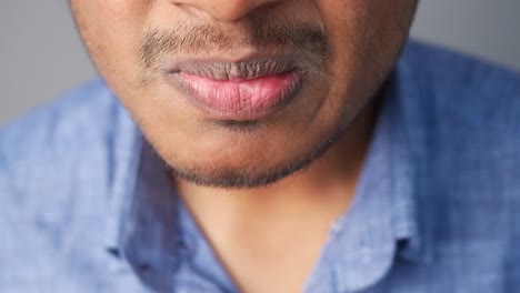 close-up of a man's mouth with dry or discolored lips