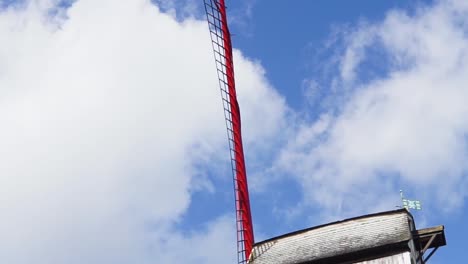 old windmill against blue sky