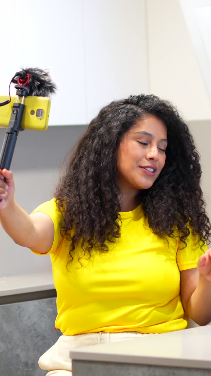 Woman vlogging in the kitchen