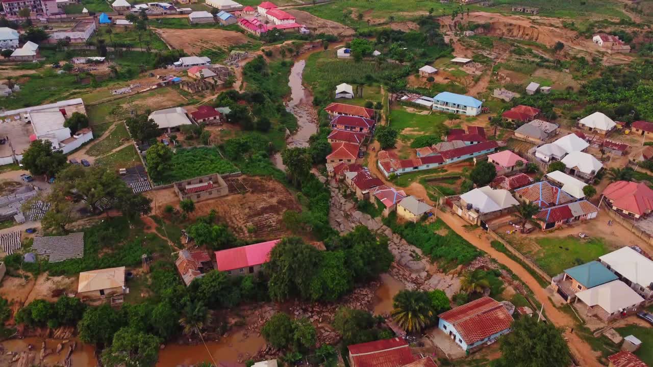 Beautiful aerial of a dry river running through the town of Kurudu Nyanya, Nigeria