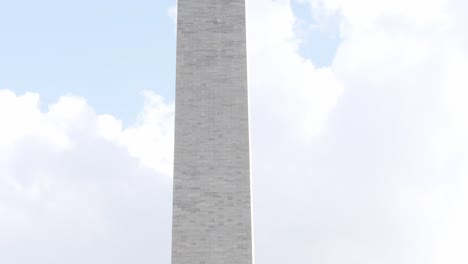 Close-up-of-the-Washington-Monument-through-some-trees-located-in-Washington-DC-in-the-USA