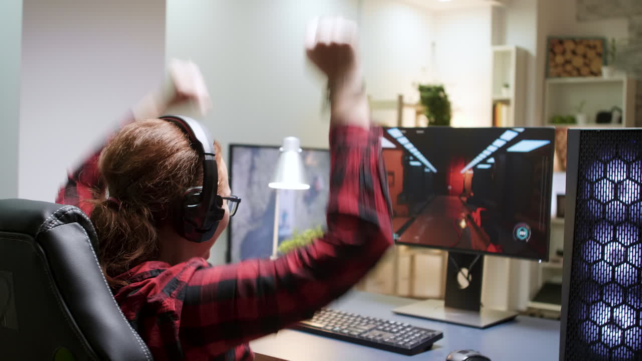 Woman playing video games on her computer