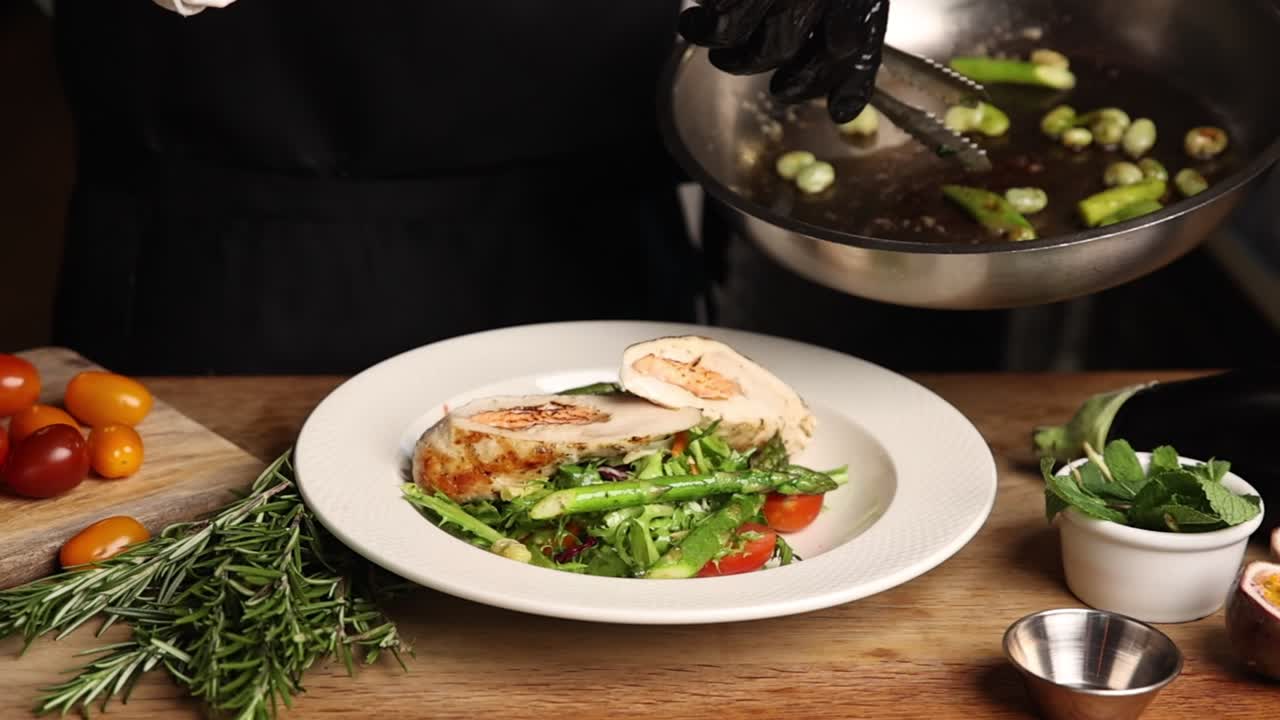Chef Plating a Gourmet Chicken and Asparagus Meal