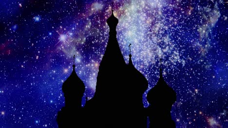 the black silhouette shape of the kremlin palace in moscow, russia, over a moving starscape timelapse background