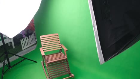 photo or video studio with two hexagone studio lights. green screen and rocking chair