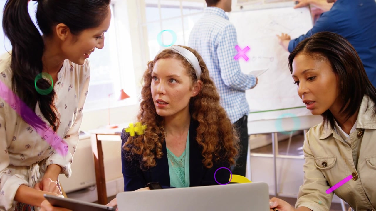 Three women presenting tablet at laptop reviewing project in business overlays obscuring screens