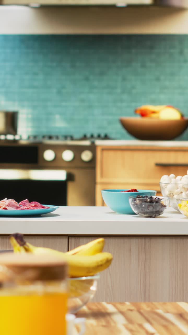 Vertical Video Empty kitchen with wooden dining furniture and modern appliances