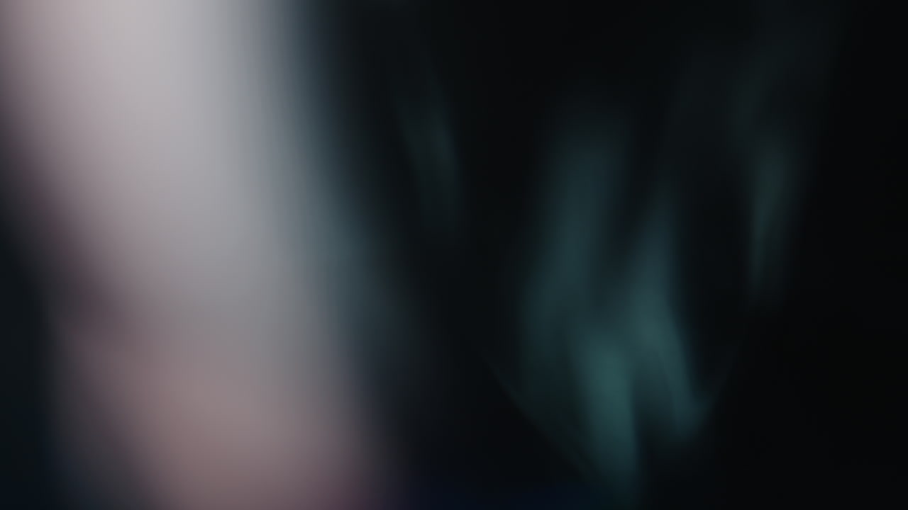 Multicolored light leaks 4k footage on black background stylizing video transitions bokeh effect
