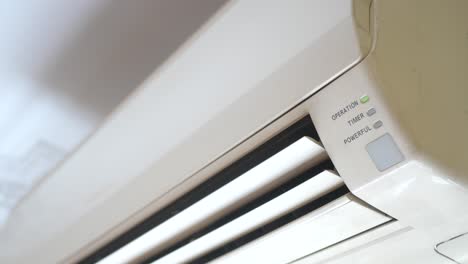 close-up of an air conditioner unit with buttons