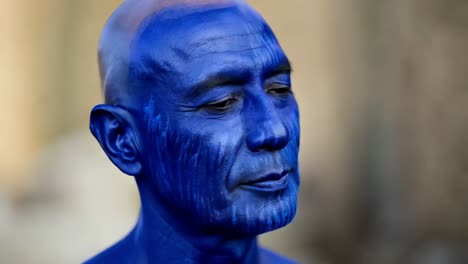 man with blue face paint