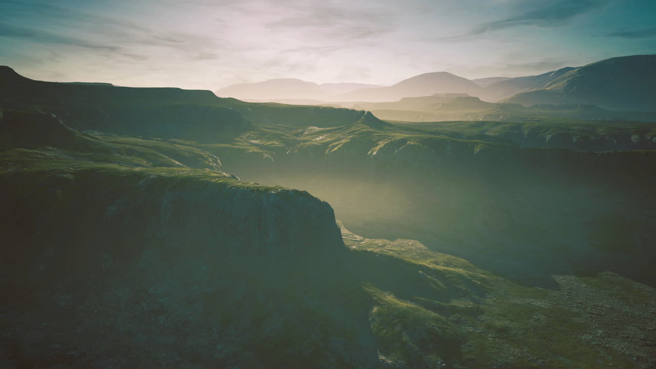 Majestic landscape with rolling hills at dawn in a serene valley