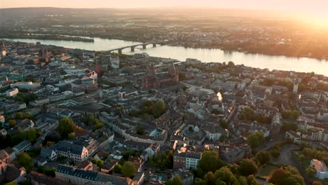 Wide-Drohne-shot-of-Mainz-with-very-early-golden-morning-light-on-a-perfect-sunny-summer-day-in-Germany-by-a-aerial-drone