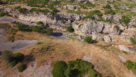 Aerial:-A-monastery-and-caves-in-the-mountains-of-Samos,-Greece