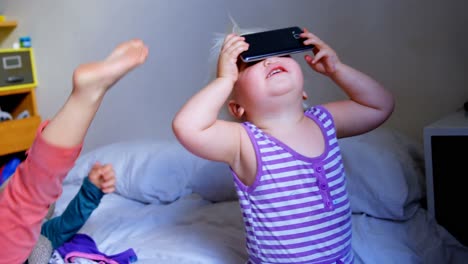 siblings playing together in bedroom at home 4k