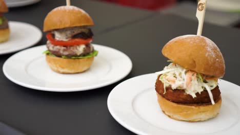 mini grilled bbq beef burgers with cheese, tomato and salad