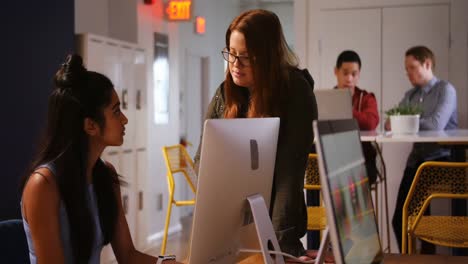 Two-female-executives-discussing-with-each-other-4k