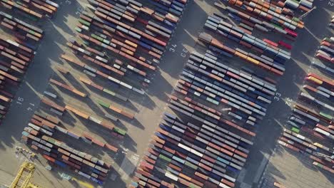 aerial freight harbor containers at cargo port in barcelona top down shot