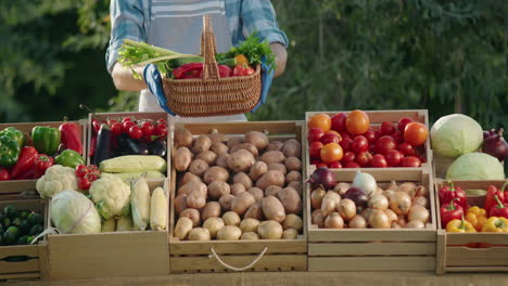 vendor holding a basket of vegetables at a farmer's market counter