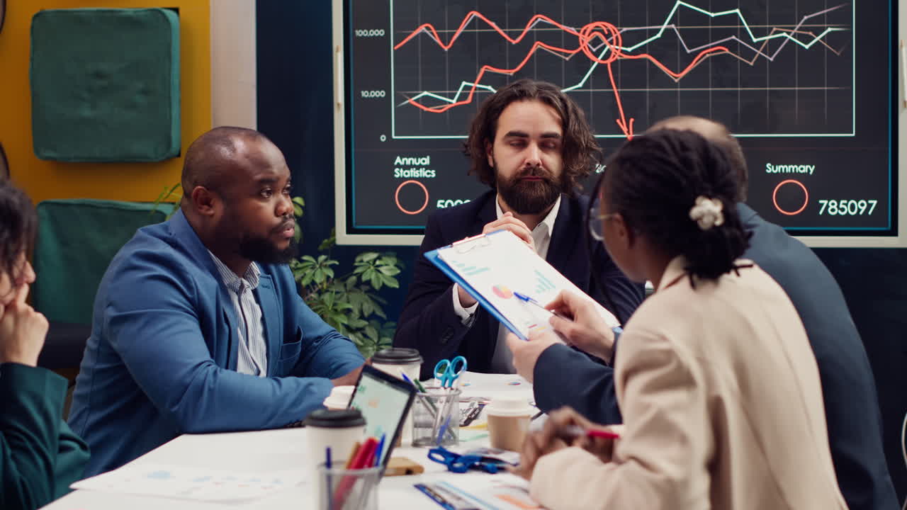 Coworkers addressing innovation initiatives in research and development efforts