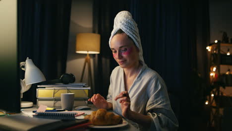 Positive-woman-typing-computer-closeup.-Smiling-bathrobe-lady-relaxing-with-pc