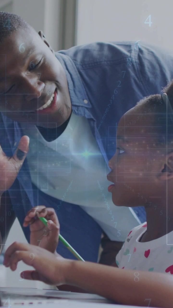 Vertical video: Dad pointing green pencil, guiding girl through learning, celebrating completion
