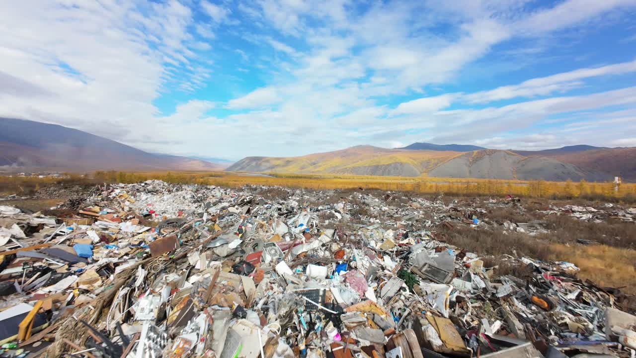 Massive Garbage Dump in Mountainous Landscape