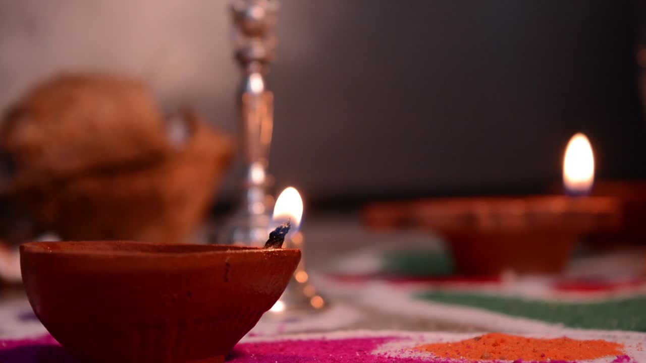 Diwali terracotta diyas on dark background which is used lighting up the house during Diwali times
