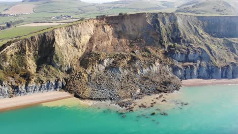 Vista-Aérea-De-La-Enorme-Caída-Del-Acantilado-De-La-Costa-Jurásica-En-Seatown-En-Dorset